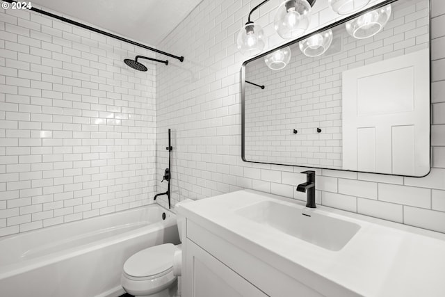 full bathroom with vanity, tiled shower / bath combo, toilet, tile walls, and tasteful backsplash