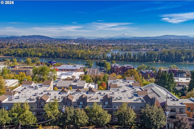 aerial view featuring a water and mountain view