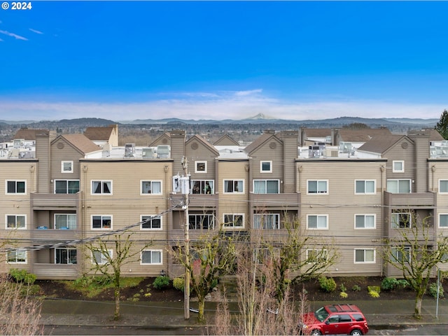 view of building exterior with a mountain view