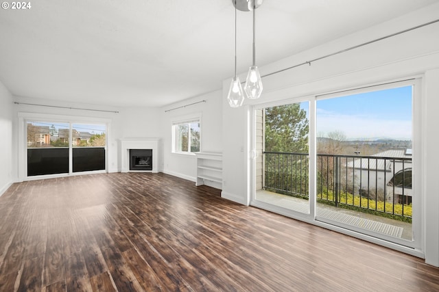 unfurnished living room featuring hardwood / wood-style floors