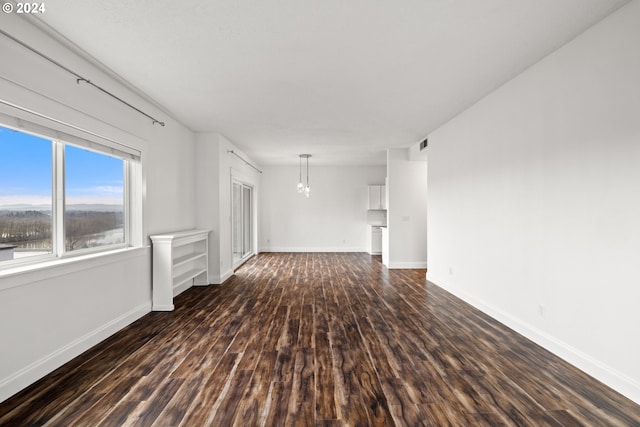 unfurnished room featuring dark hardwood / wood-style floors