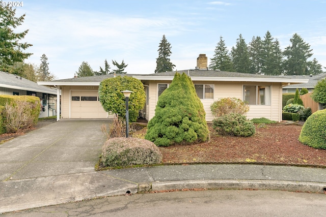 single story home featuring a garage