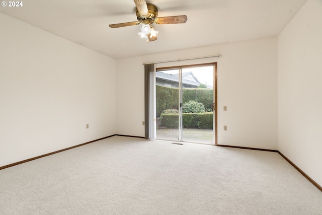 spare room with ceiling fan and carpet floors