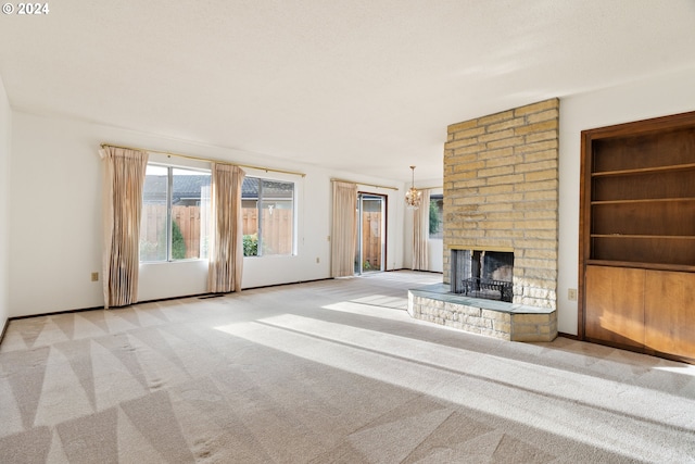 unfurnished living room with light colored carpet and a fireplace