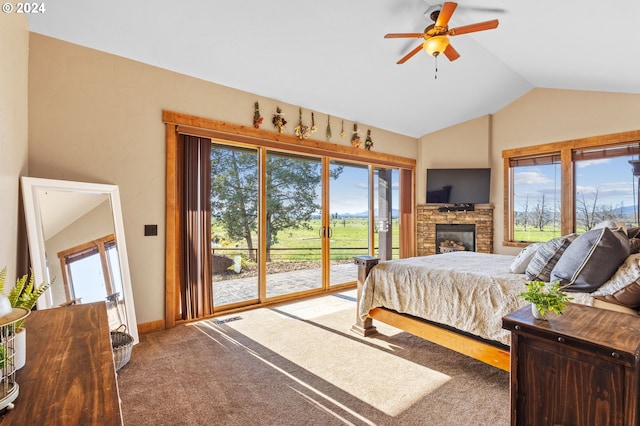 carpeted bedroom with access to outside, multiple windows, ceiling fan, and vaulted ceiling