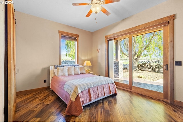 bedroom featuring access to outside, ceiling fan, and dark hardwood / wood-style flooring