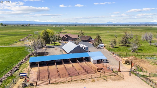 birds eye view of property featuring a mountain view and a rural view