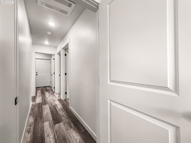 hallway featuring dark wood-type flooring