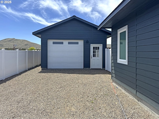 660 E St E, Baker City, OR 97814 - garage featuring a mountain view
