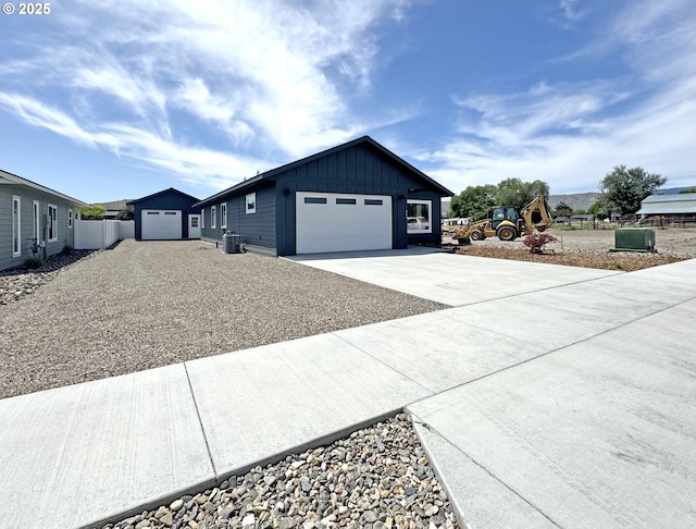 660 E St E, Baker City, OR 97814 - view of property exterior with concrete driveway, board and batten siding, and a garage