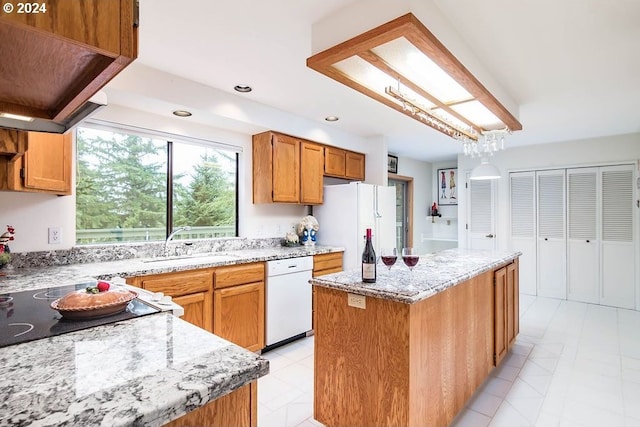 kitchen featuring a center island, white appliances, custom range hood, light tile floors, and sink