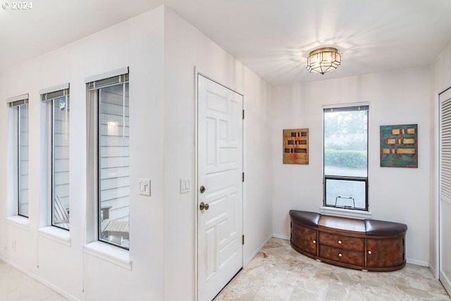 foyer featuring light tile flooring