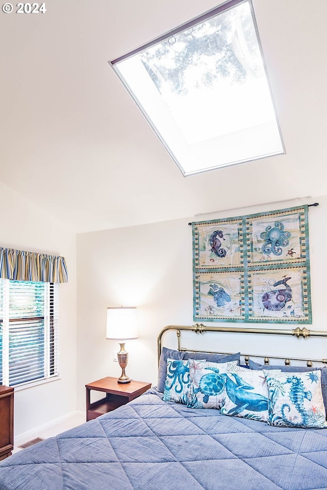 bedroom featuring a skylight