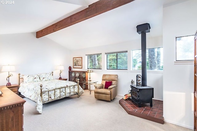 carpeted bedroom featuring lofted ceiling with beams and a wood stove