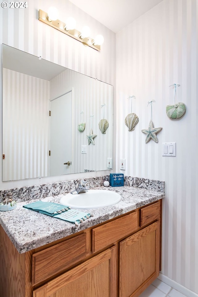 bathroom with vanity and tile floors