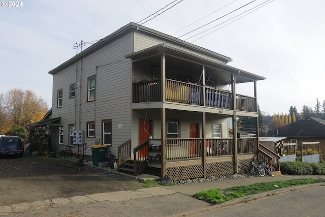 view of front of home with a balcony