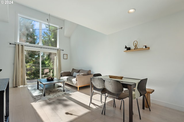 dining space featuring light wood-type flooring