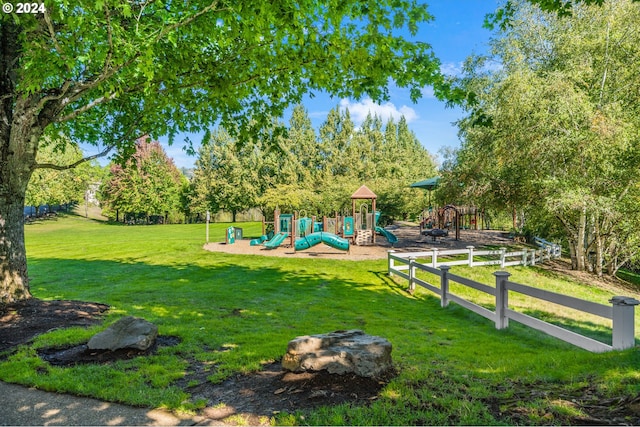 view of playground with a lawn