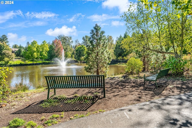 surrounding community featuring a water view