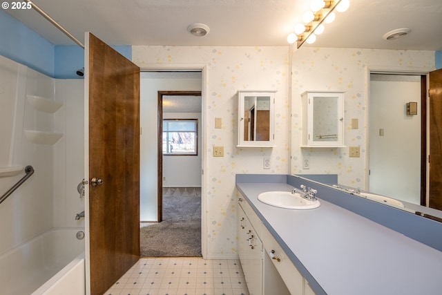 bathroom featuring shower / washtub combination and vanity