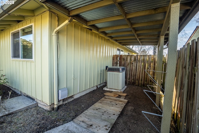 view of side of home featuring central air condition unit