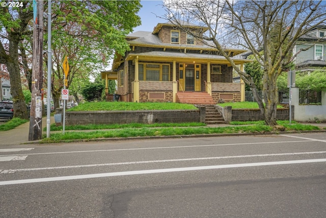 view of front of home featuring covered porch