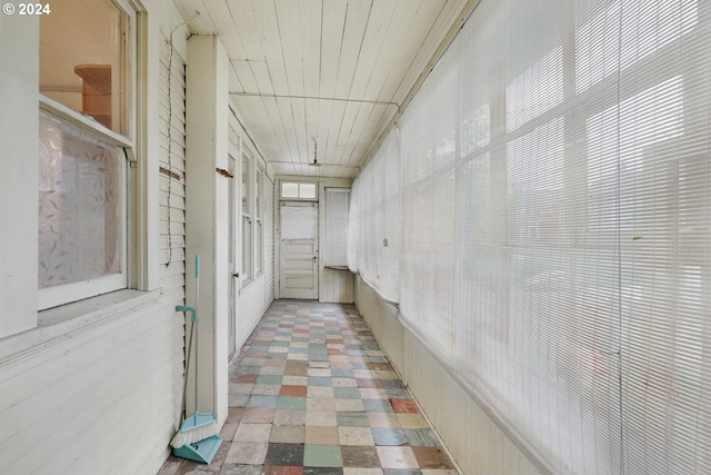 hall with tile floors