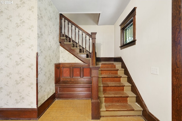 stairway featuring hardwood / wood-style flooring