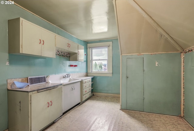 kitchen with light tile floors and sink