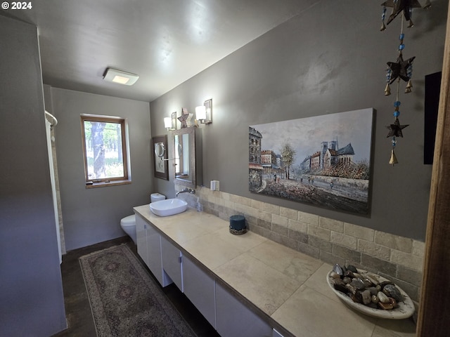44 Justanother Rd, Goldendale, WA 98620 - bathroom with toilet, double vanity, tasteful backsplash, and a shower