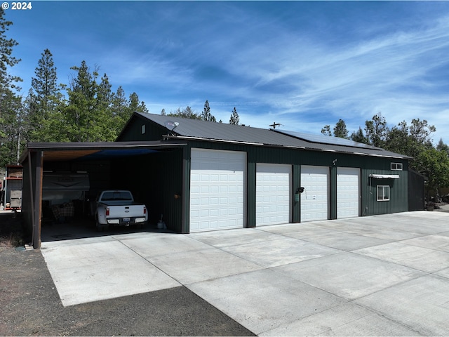 44 Justanother Rd, Goldendale, WA 98620 - garage featuring roof mounted solar panels and a garage