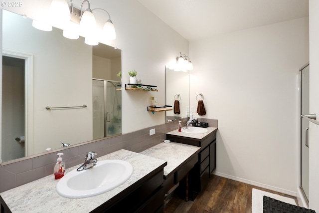 27309 8th St, Junction City, OR 97448 - full bath with a shower stall, vanity, wood finished floors, and decorative backsplash