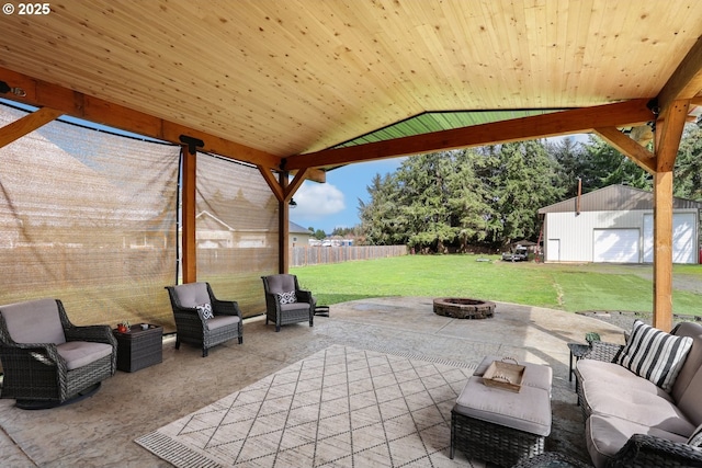27309 8th St, Junction City, OR 97448 - view of patio with an outdoor living space with a fire pit, a fenced backyard, and an outdoor structure