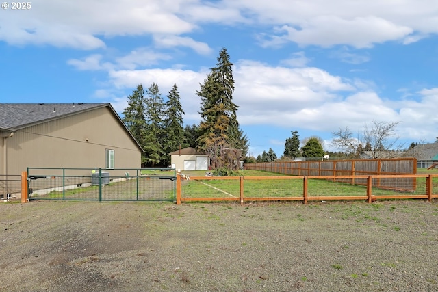 27309 8th St, Junction City, OR 97448 - view of yard with an outbuilding, fence, and a gate