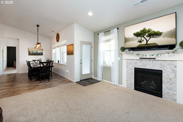27309 8th St, Junction City, OR 97448 - carpeted living room featuring visible vents, baseboards, a tiled fireplace, recessed lighting, and vaulted ceiling