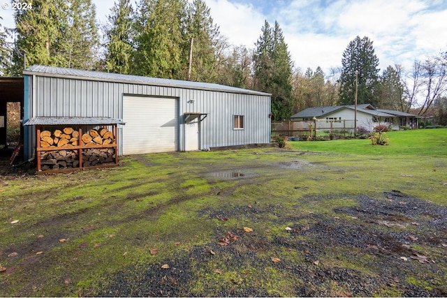 view of yard with a garage and an outdoor structure