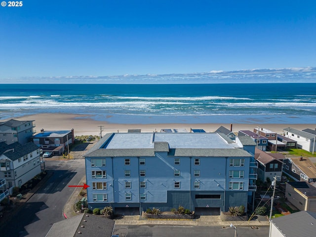 bird's eye view with a water view and a view of the beach