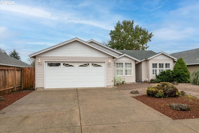 single story home featuring a garage