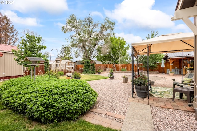 view of yard featuring a gazebo and a patio