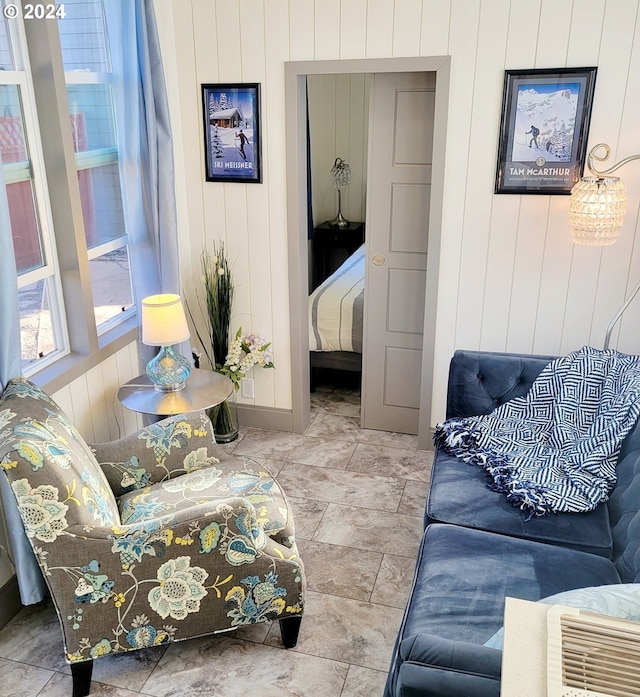 living room featuring wood walls