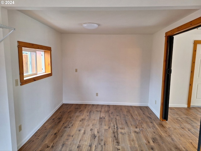 spare room featuring hardwood / wood-style flooring