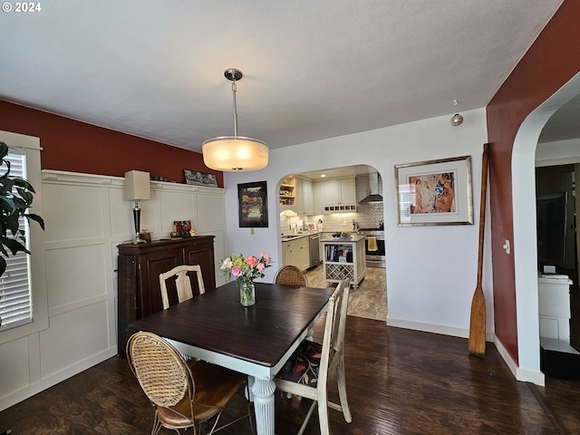 dining room with dark hardwood / wood-style flooring