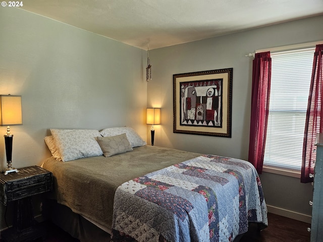 bedroom featuring dark hardwood / wood-style flooring