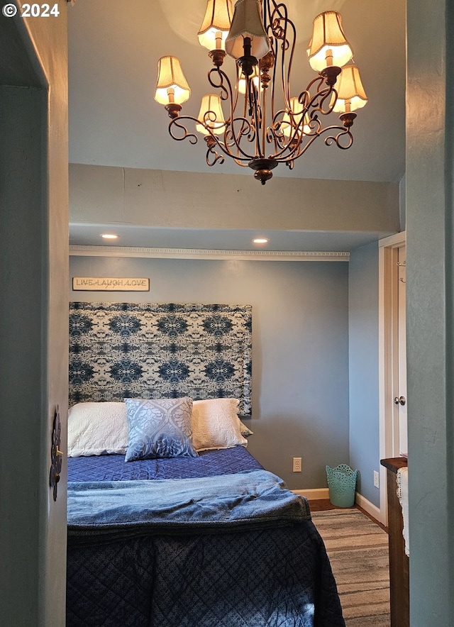 bedroom featuring a notable chandelier