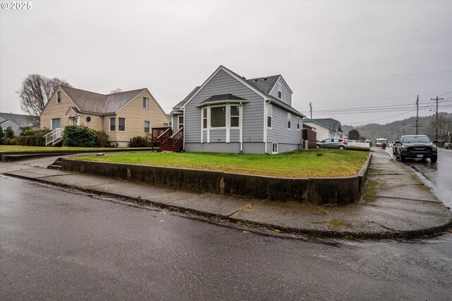 bungalow with a front lawn