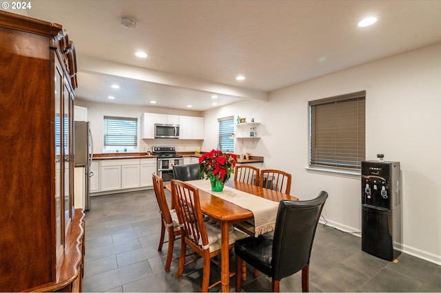 dining room featuring recessed lighting and baseboards