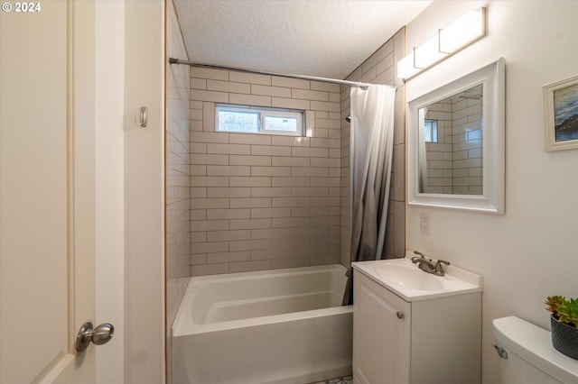 full bathroom with toilet, shower / tub combo, a textured ceiling, and vanity