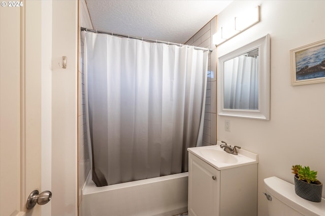 full bathroom with toilet, shower / tub combo, a textured ceiling, and vanity