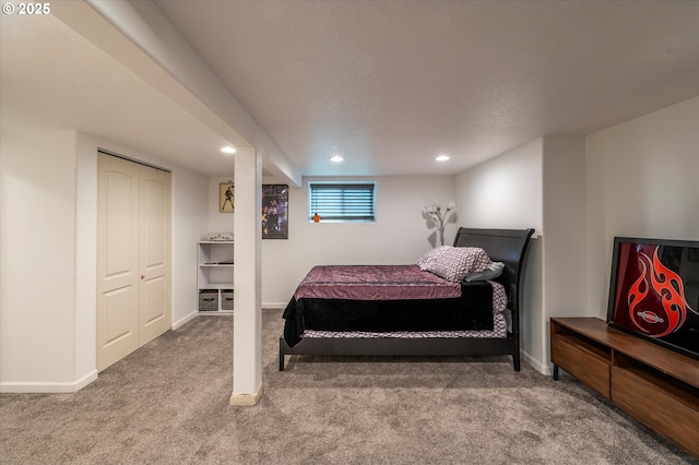 carpeted bedroom featuring recessed lighting and baseboards