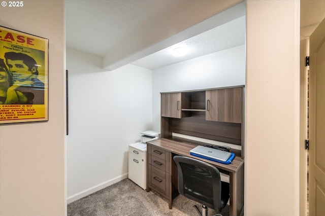 office area with light carpet and baseboards